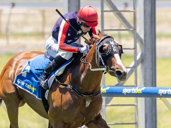 Gotta Go Guru, ridden by Jason Holder, wins a Benchmark 76 (2250m) on Saturday at Morphettville. Picture: Makoto Kaneko