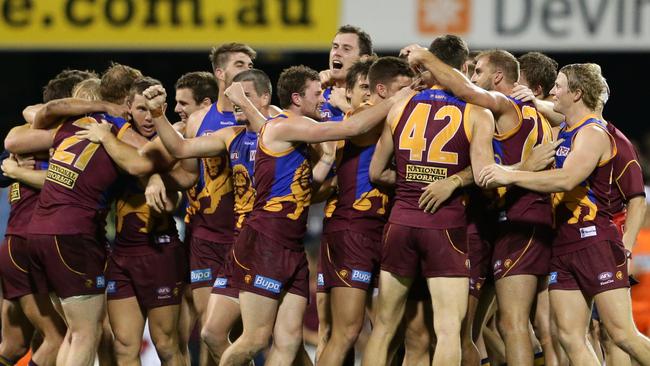 Ash McGrath was mobbed after his incredible winning goal in 2013. Picture: Darren England.