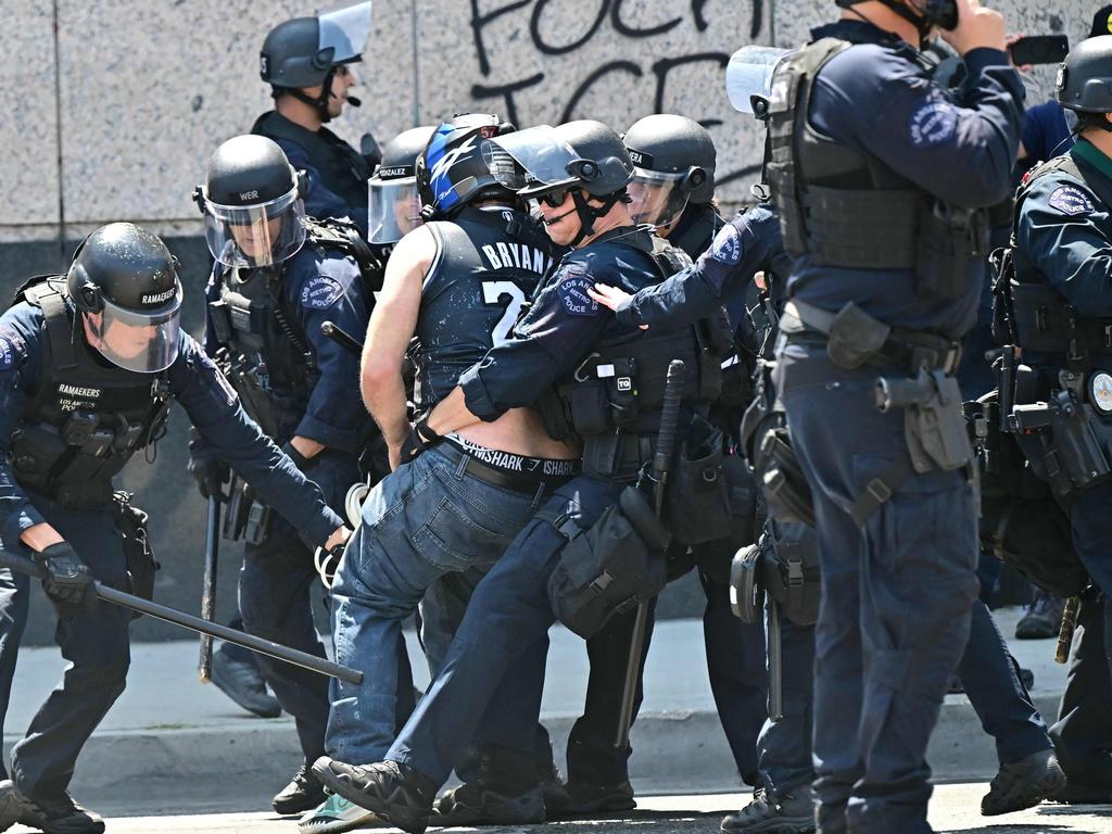 Law enforcement clash with demonstrators outside the Metropolitan Detention Center, MDC, in downtown Los Angeles, California. Picture: AFP
