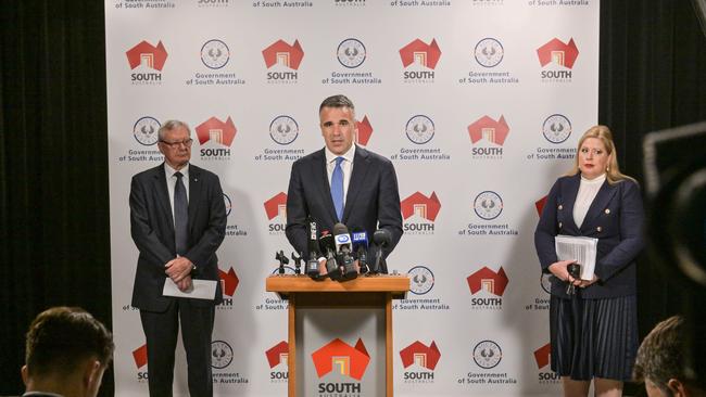 Premier Peter Malinauskas, flanked by former Police Commissioner Mal Hyde and Child Protection Minister Katrine Hildyard as they release Mr Hyde’s recommendations for improving the child protection system. Picture: NCA NewsWire / Brenton Edwards