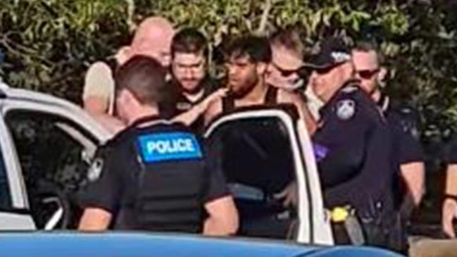 Ryan Sampson, 33, is arrested by Queensland police near Fig Tree Creek in Yeppoon on November 24, 2024. He was extradited to NSW on Tuesday to face a murder charge over the death of James Callahan at Hamilton in November.