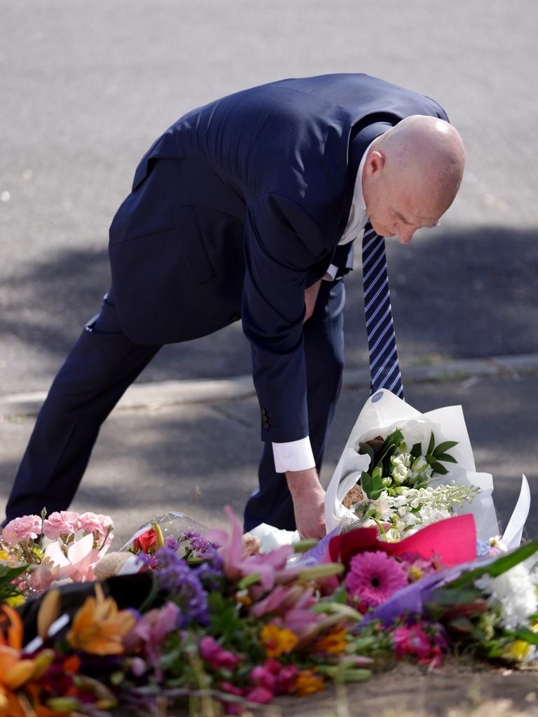 TASMANIA, AUSTRALIA - NewsWire Photos: DECEMBER 17 2021 : Premier Peter Gutwein lays flowers at Hillcrest Primary school. Picture: NCA Newswire / Grant Viney