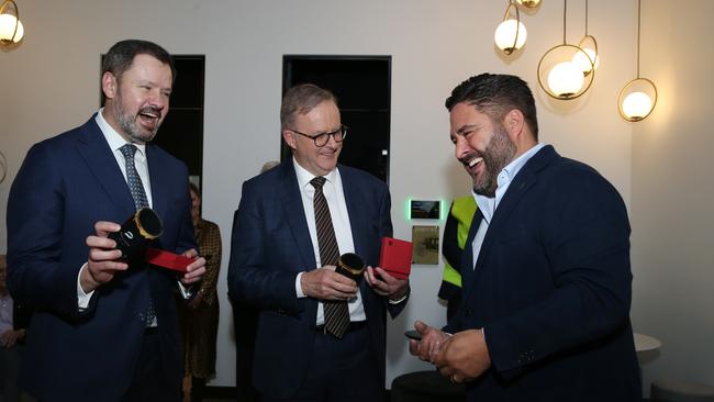 Industry Minister Ed Husic and Prime Minister Anthony Albanese share a joke with Andrew Cochineas during a visit to ABC ­Refinery in 2022. Picture: Britta Campion