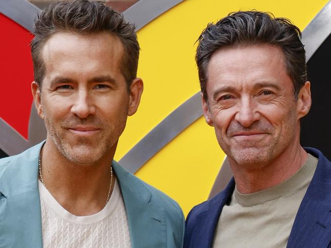 FILE - Ryan Reynolds, left, and Hugh Jackman pose for photographers upon arrival at the screening of the film 