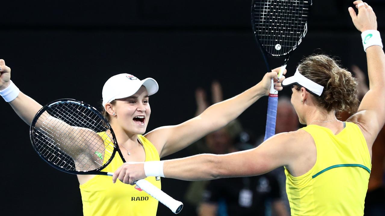 Ashleigh Barty and Samantha Stosur of Australia celebrate winning against Belarus.