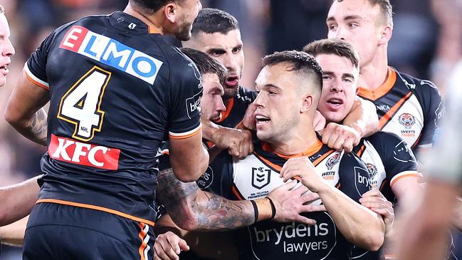 Luke Brooks is swamped by teammates after his field goal. Picture: Mark Kolbe/Getty Images