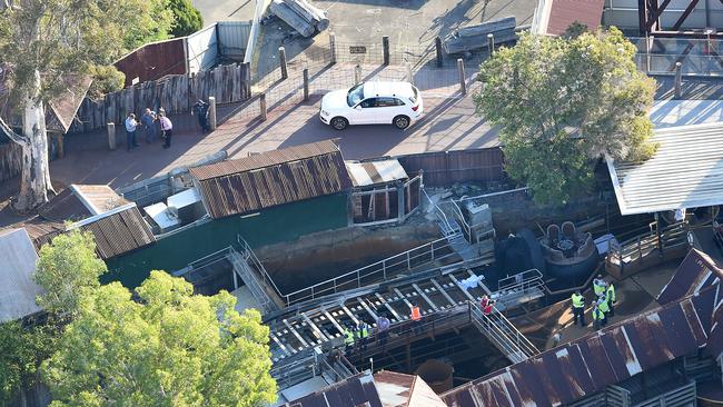 Police and emergency services personnel at the Thunder River Rapids Ride after the accident that killed four people. Picture: AAP