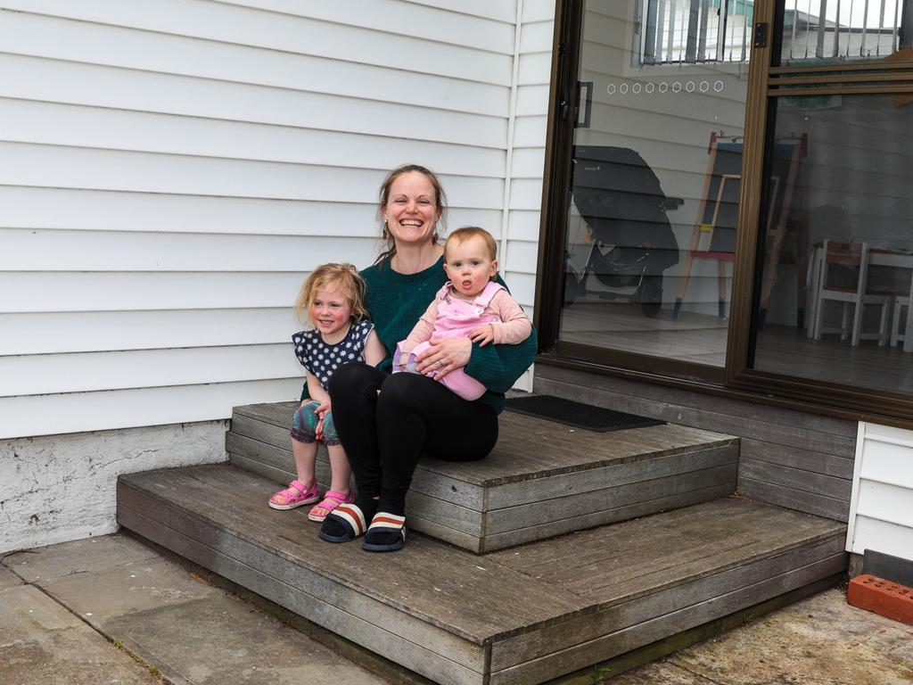 Sophie Bullock, with her children Freya and Jasmine, says the family is saving thousands of dollars a year on their power bill since installing solar panels. Picture: Mireille Merlet