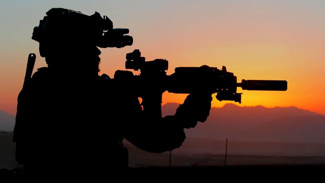 An Australian Army soldier from Special Operations Task Group prepares for a night mission with the Afghan National Security Force's Special Response Team in Oruzgan province, Afghanistan, in 2010. Picture: Department of Defence