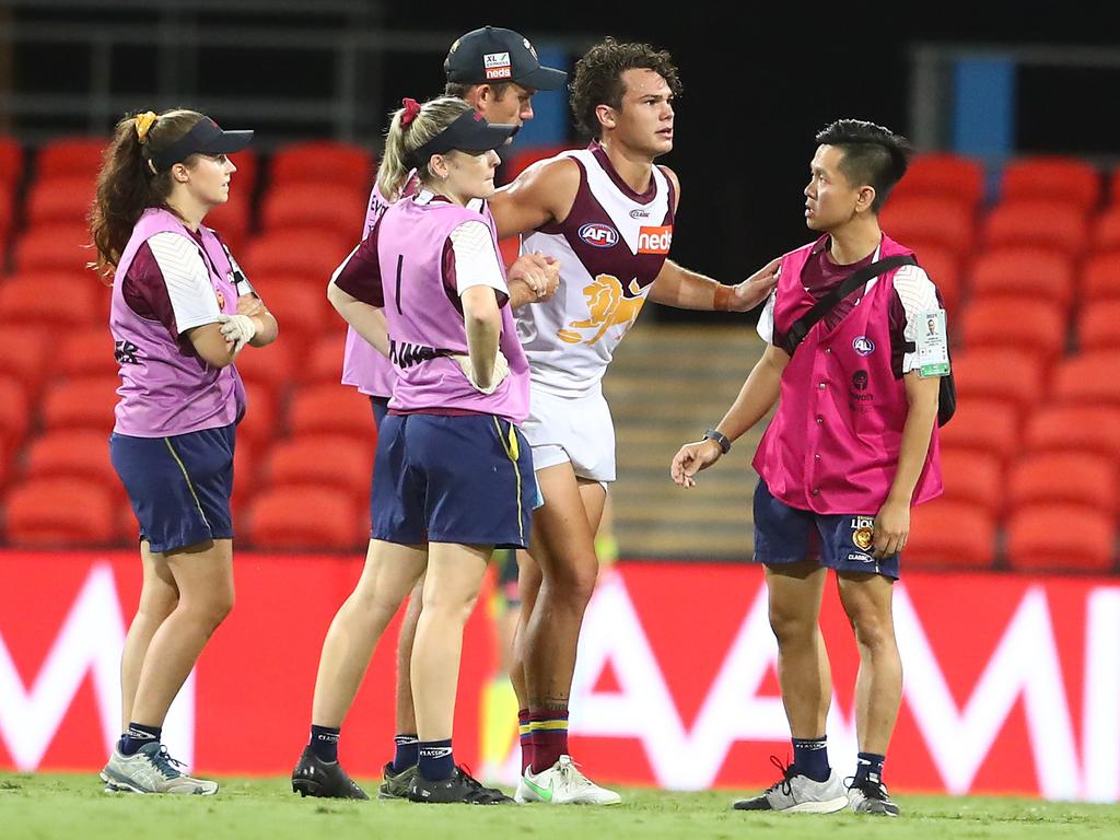 Lions star Cam Rayner liimps off after injuring his knee a year ago. Picture:Chris Hyde/Getty Images