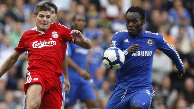Chelsea's Michael Essien, right, competes with Liverpool's Steven Gerrard.
