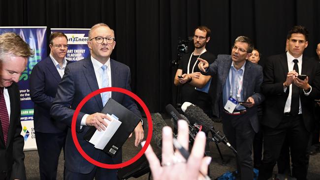 Opposition Leader Anthony Albanese holds his briefings folder as he leaves after speaking to the media in Sydney on Thursday. Picture: Lukas Coch/AAP