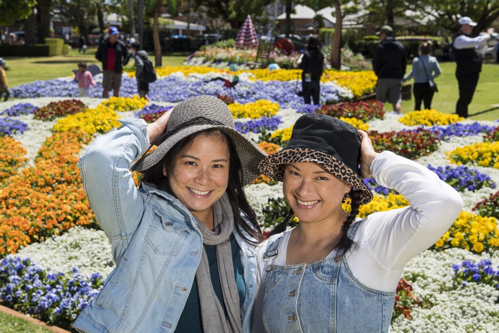 Sisters Kim Huynh (left) and Lyn Ha in Laurel Bank Park during Carnival of Flowers 2020, Saturday, September 26, 2020. Picture: Kevin Farmer