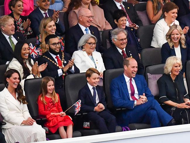 Kate Middleton, Princess Charlotte, Prince George, Prince William and Camilla at the Party at the Palace. Picture: AFP