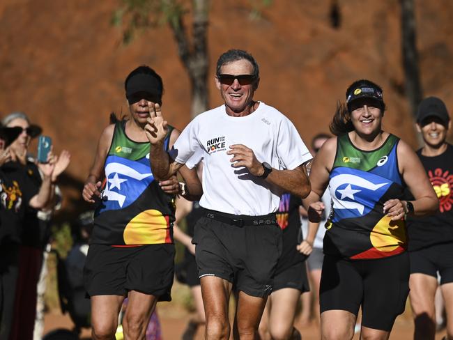 ULURU, AUSTRALIA, NewsWire Photos. OCTOBER 11, 2023: The Australian Prime Minister Anthony Albanese with Pat Farmer as he finishes his run around the country to raise awareness about the Yes campaign in Uluru. Picture: NCA NewsWire / Martin Ollman