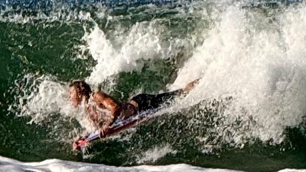 Board riders were being crunched in the big swell at Mooloolaba late Thursday afternoon as Tropical Cyclone Alfred hovered off the  Qld coastline. Photo: Mark Furler