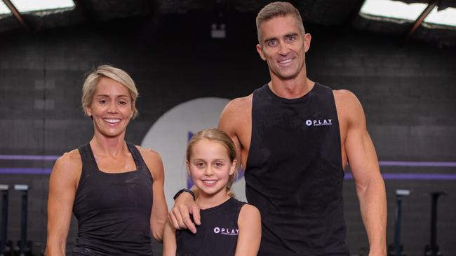 Kareena, Luke and daughter Chloe Hogan enjoy an Olympic Lift workout at Crossfit Play. Picture: Adrian Fowler