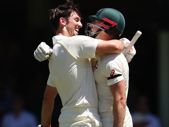 The Marsh lads celebrate Mitch’s ton.