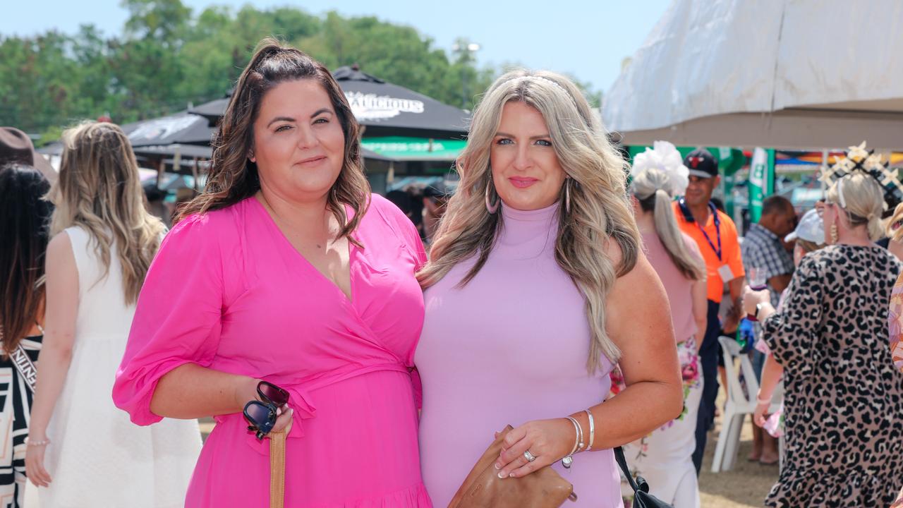 Natalie Baker and Kirsty Barbey having a ball at The Great Northern Darwin Cup at Fannie Bay Turf Club. Picture: Glenn Campbell