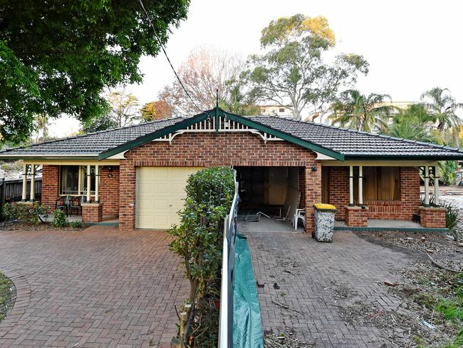 Demolished houses surround 26 Park Ave at Waitara in May 2018 before it was destroyed. Picture: Troy Snook