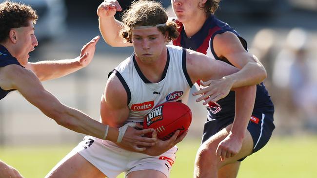 MELBOURNE, AUSTRALIA - SEPTEMBER 17: Patrick Hughes of the Geelong Falcons is tackled during the Coates Talent League Boys Preliminary Final match between Sandringham Dragons and Geelong Falcons at Queen Elizabeth Oval on September 17, 2023 in Melbourne, Australia. (Photo by Graham Denholm/AFL Photos via Getty Images)