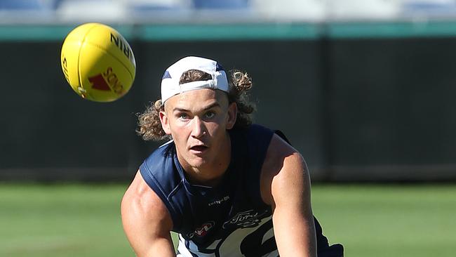 Rookie Cat Blake Schlensog claims a mark at Geelong training. Picture: Alison Wynd.