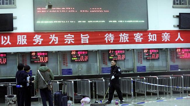Chinese police investigators ... inspect the scene of an attack at the railway station in Kunming, southwest China's Yunnan province. Picture: AFP