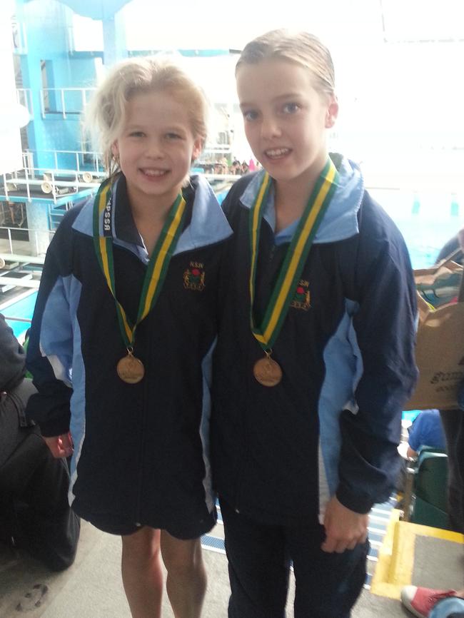 Jade Sweeney (r) with her partner Kennedy Cooper after winning synchro gold.