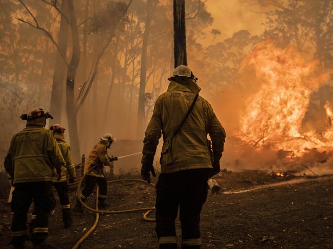 Firefighters battle the Currowan mega-blaze on the south coast. Picture: Gary Ramage