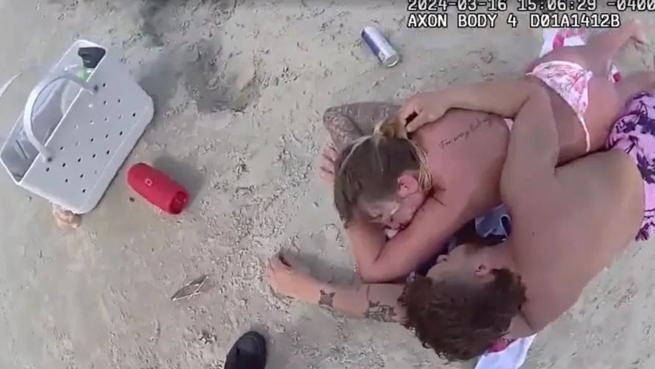 A Georgia couple has been arrested after they allegedly passed out drunk on the beach while their children ran off.