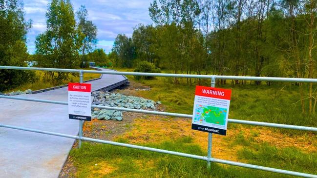 New signs were erected with maps showing the suspected contaminated area and warning people about possible contamination of fish caught in the Logan River. Picture: Judith Kerr