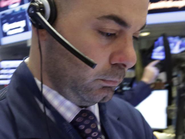 Trader Fred Demarco, right, works on the floor of the New York Stock Exchange, Monday, April 11, 2016. U.S. stocks opened higher on Wall Street following gains overseas as investors held out hope for more economic stimulus from China. (AP Photo/Richard Drew)