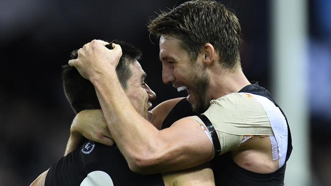 Matthew Kreuzer (left) and Dale Thomas of the Blues react after the final siren during the Round 12 AFL match between the Carlton Blues and the GWS Giants at Etihad Stadium in Melbourne, Sunday, June 11, 2017. (AAP Image/Julian Smith) NO ARCHIVING, EDITORIAL USE ONLY