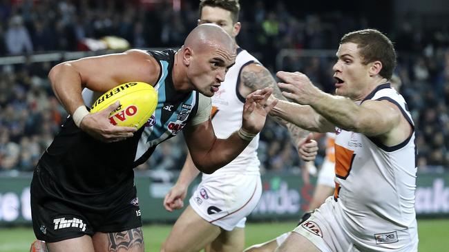 Strong-bodied midfielder Sam Powell-Pepper fends of Giant Heath Shaw in Round 19. Picture: SARAH REED