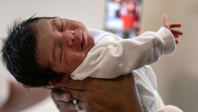 Baby Neysel was delivered under astonishing circumstances while his mother battled COVID-19. Picture: AFP.