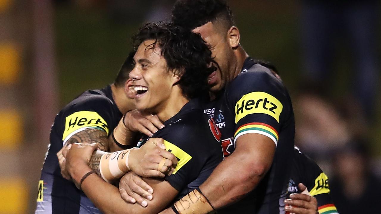 Jarome Luai of the Panthers celebrates with his teammates after scoring a try.