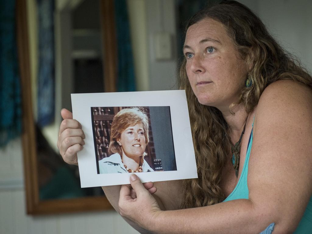 Shanelle Dawson, holding a picture of her missing mum, is friends with the stepchildren from her father’s third marriage. Picture: John Wilson.