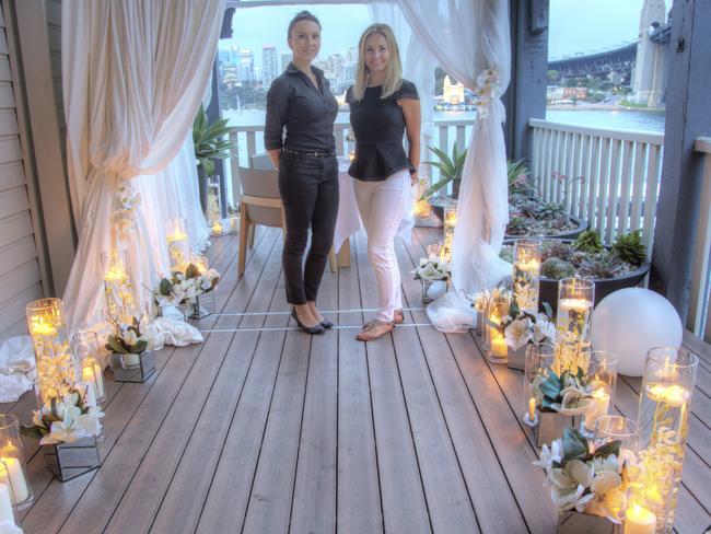 Amelia Johnson and Sam Davies from Unforgettable Proposals at Pier 1, setting up a proposal. Photo by Leigh Hope.