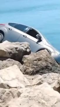 Bystanders shocked after pensioner nearly drives off cliff