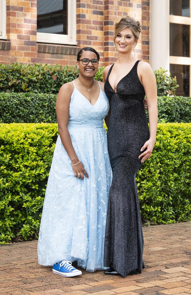 Graduates Jorja Niki (left) and Tillie Nixon as Downlands College year 12 students come together for their valedictory mass at the college, Saturday, November 16, 2024. Picture: Kevin Farmer