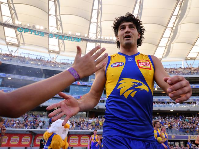 PERTH, AUSTRALIA – MARCH 24: Tom Barrass of the Eagles high fives as he runs out onto the ground during the round two AFL match between West Coast Eagles and Greater Western Sydney Giants at Optus Stadium, on March 24, 2024, in Perth, Australia. (Photo by James Worsfold/AFL Photos/via Getty Images )