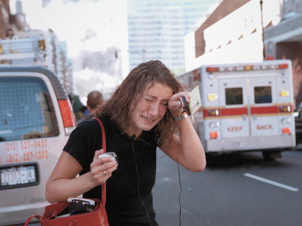 A young woman cries in lower Manhattan following the terrorist attack on September 11, 2001. Picture: Don Halasy/Alamy