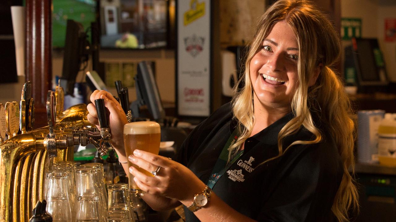 Leanne Krostiiansen pours the first beer at Shenanigans. Picture GLENN CAMPBELL