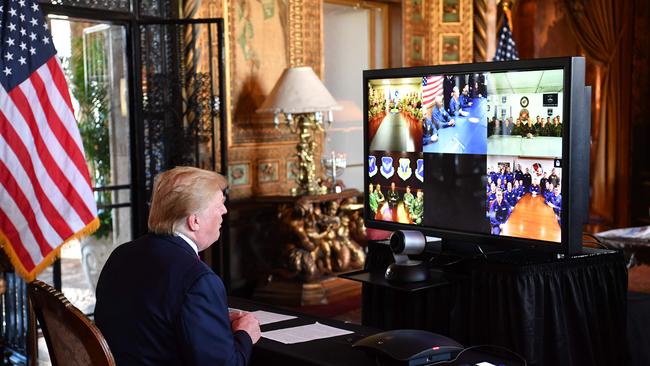 Donald Trump makes a video call to the troops stationed worldwide from his Mar-a-Lago estate in West Palm Beach, Florida, last Christmas Eve. Picture: AFP