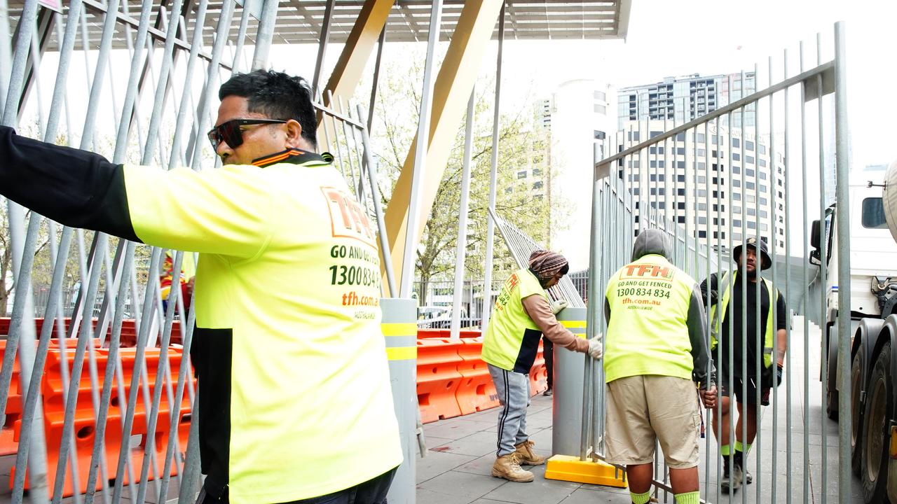 Workers erected bollards and fencing around the Melbourne Exhibition and Convention Centre on Friday ahead of a Disrupt Land Forces protest. Picture: NewsWire / Luis Enrique Ascui