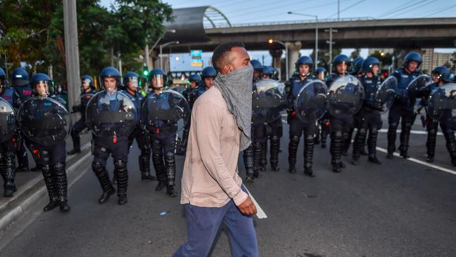 Police were powerless to unmask protesters at Melbourne Pavilion. Picture: Jake Nowakowski