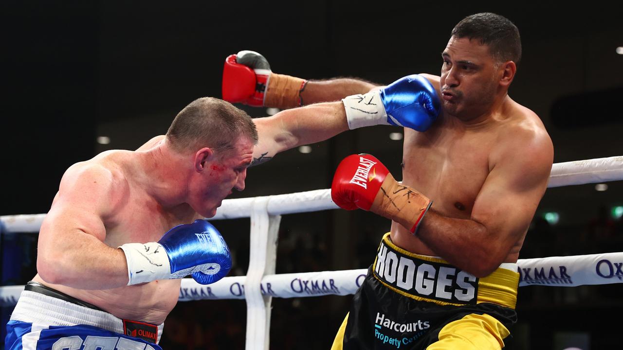 Paul Gallen and Justin Hodges exchange punches during their first bout in September. Photo by Chris Hyde/Getty Images