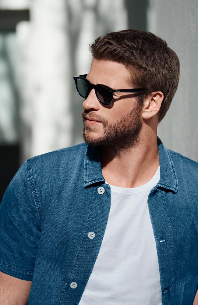 Hemsworth is free to check out other women behind the safety of his OPSM frames. Picture: Hugh Stewart