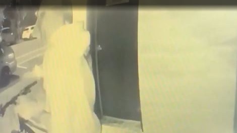 CCTV footage from a Surfers Paradise apartment building showing letters being looked through. Picture: Supplied