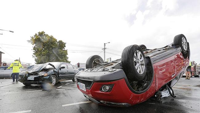 Two of the three vehicles involved in a crash on the corner of Davey and Antill streets, which led to massive traffic delays. Picture: MATHEW FARRELL